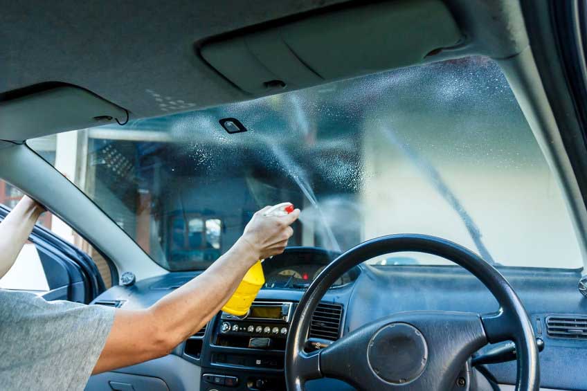 Car Films Installing windshield protection film blur.;