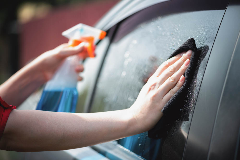 cleaning a car window glass